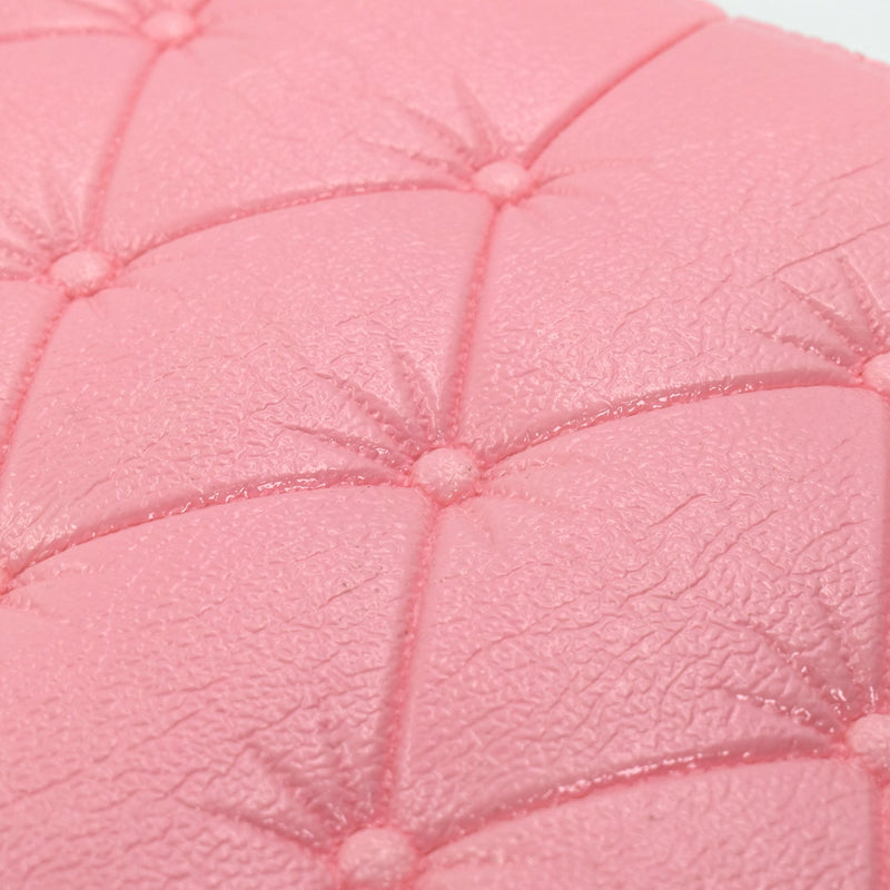 Peel-and-stick pink wallpaper with a 3D geometric pattern