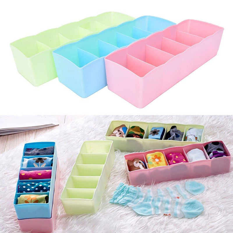 Storage box with 5 compartments for efficient organization of socks and handkerchiefs.