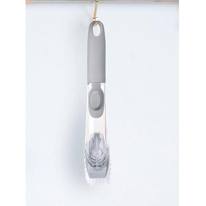 Liquid dispensing dish brush
